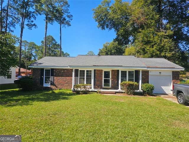 ranch-style home with a garage and a front lawn