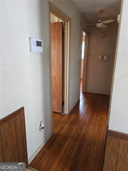 hall with dark hardwood / wood-style flooring