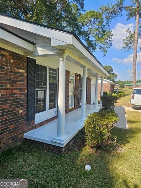 view of home's exterior featuring covered porch