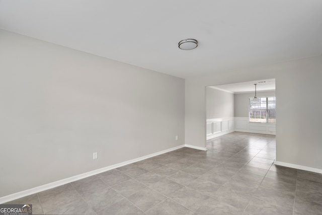 spare room with light tile patterned floors