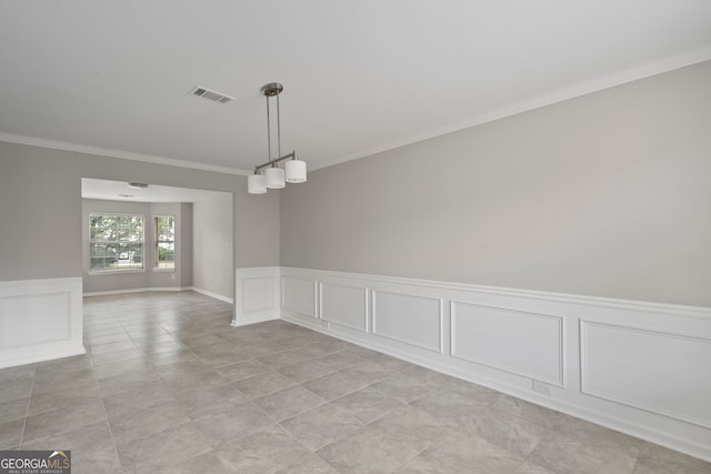 tiled empty room with crown molding and an inviting chandelier