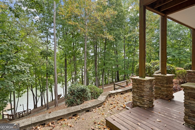 wooden deck featuring a water view