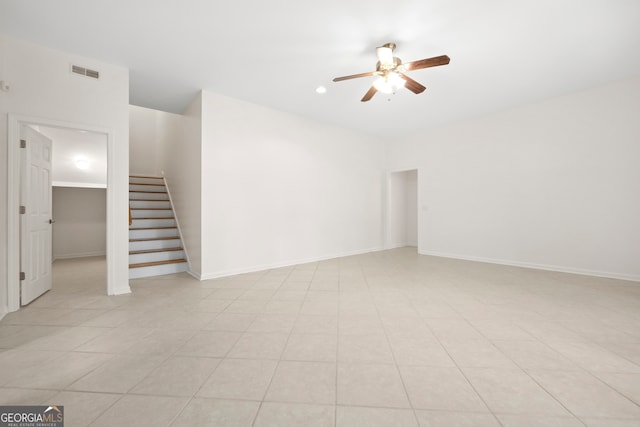 spare room with light tile patterned floors and ceiling fan