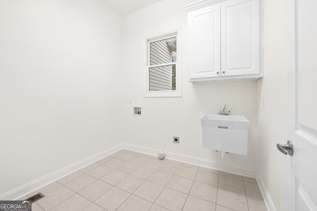 124 S Shore Dr, Fair Play, SC 29643 - washroom with cabinet space, baseboards, washer hookup, electric dryer hookup, and light tile patterned floors