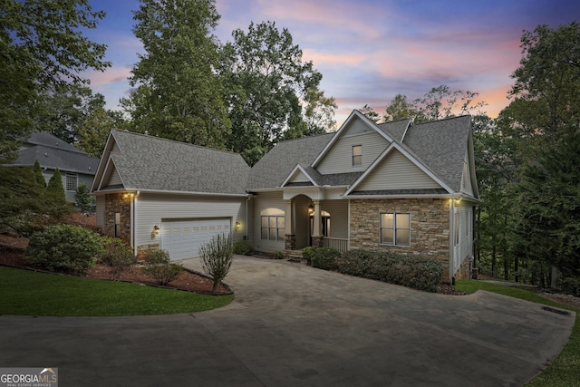124 S Shore Dr, Fair Play, SC 29643 - view of front of home with stone siding, roof with shingles, concrete driveway, and an attached garage
