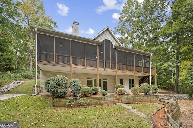 124 S Shore Dr, Fair Play, SC 29643 - rear view of property with a sunroom, a chimney, and a yard