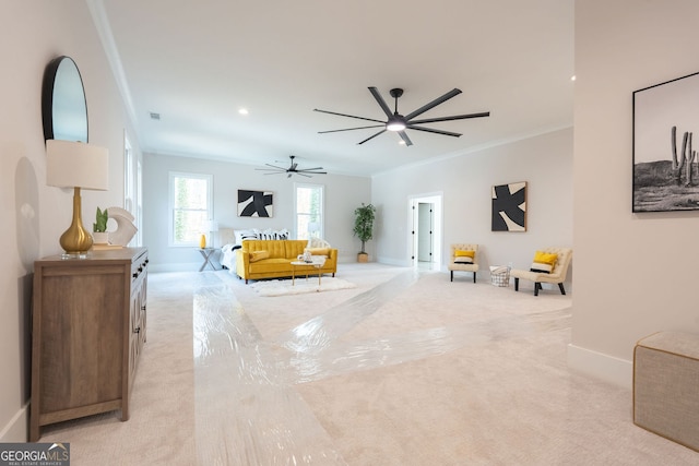 living room with crown molding, light colored carpet, and ceiling fan