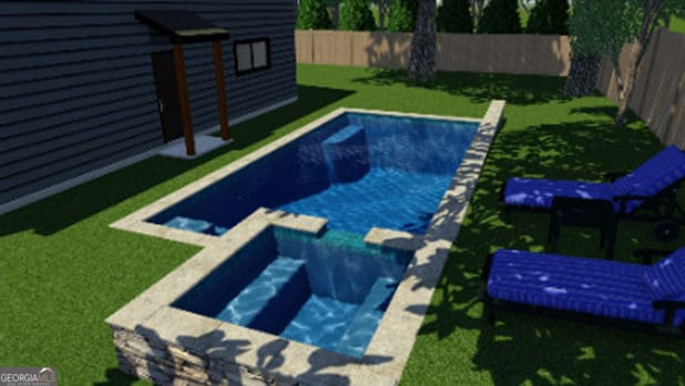 view of swimming pool with a lawn