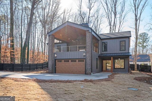 modern home with a balcony and a garage