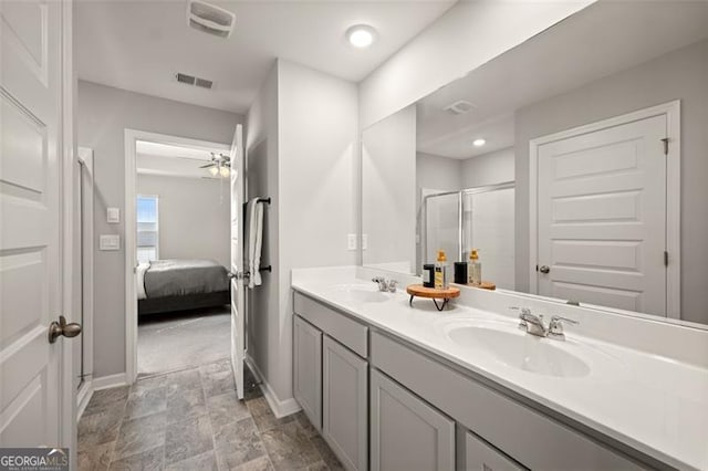 bathroom with vanity, walk in shower, and ceiling fan