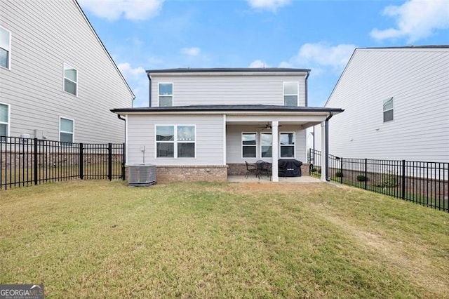 rear view of property with a yard, a patio area, ceiling fan, and central AC unit