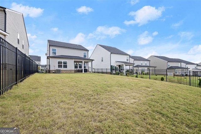 back of house featuring a yard