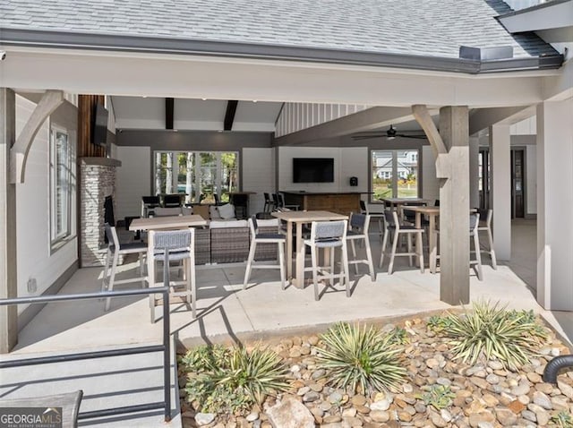 view of patio / terrace featuring ceiling fan