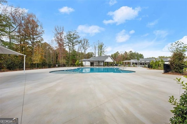 view of pool featuring a patio