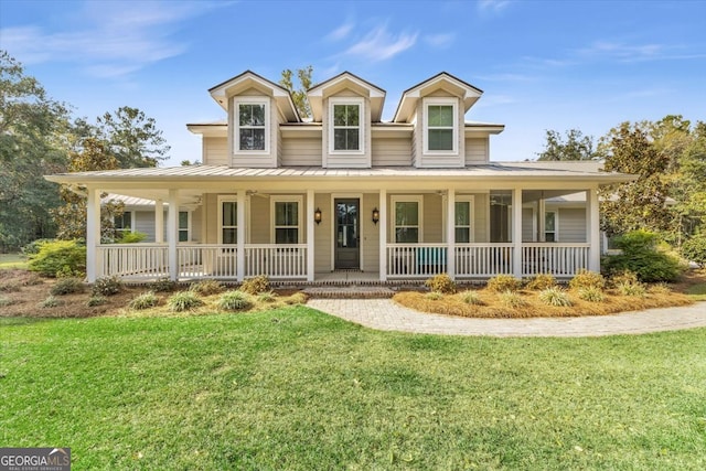 country-style home with covered porch and a front yard