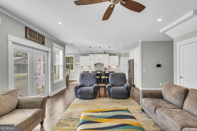 living room featuring hardwood / wood-style floors, french doors, and ceiling fan