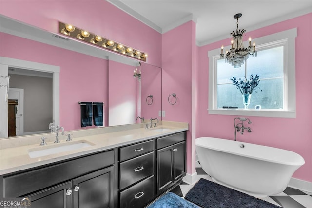 bathroom with vanity, a notable chandelier, ornamental molding, and a tub