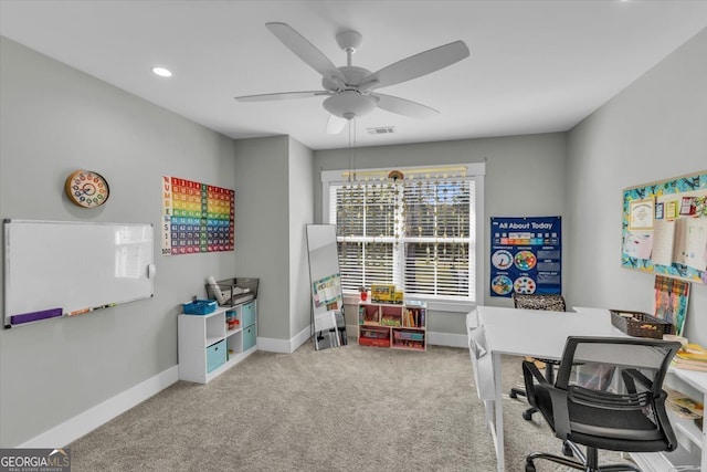 carpeted office with ceiling fan