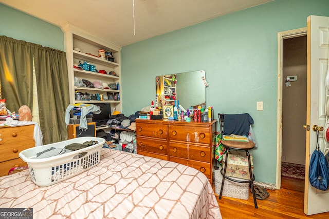 bedroom featuring hardwood / wood-style flooring