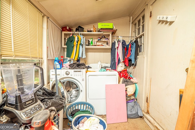 clothes washing area with washing machine and dryer