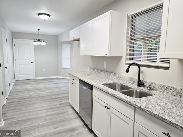 kitchen with sink, dishwasher, decorative light fixtures, white cabinets, and light hardwood / wood-style flooring