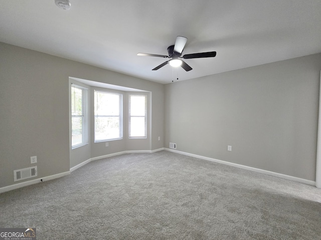 unfurnished room featuring carpet flooring and ceiling fan