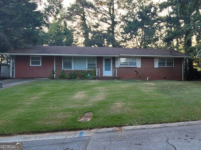 ranch-style house with a front lawn