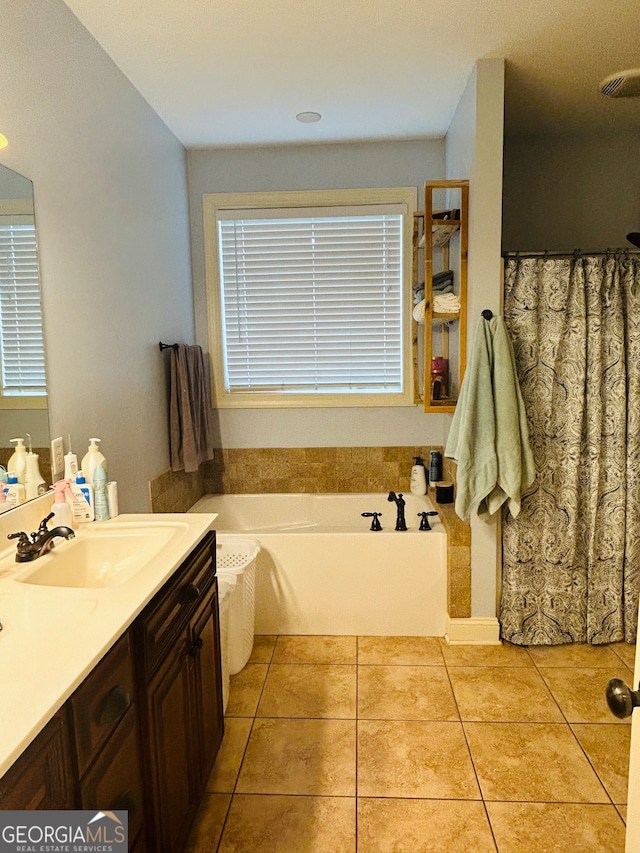 bathroom featuring vanity, tile patterned floors, and plus walk in shower