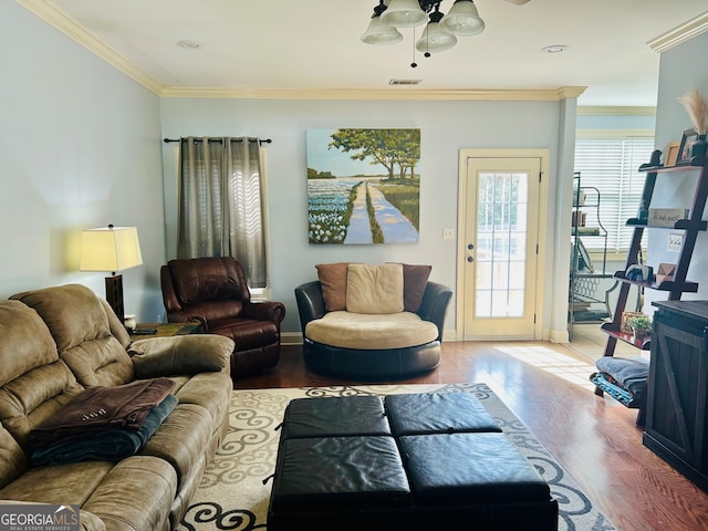 living room featuring ceiling fan, hardwood / wood-style floors, and ornamental molding