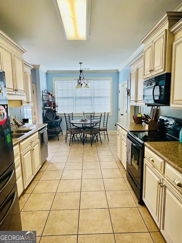 kitchen with pendant lighting, black appliances, ornamental molding, and cream cabinetry