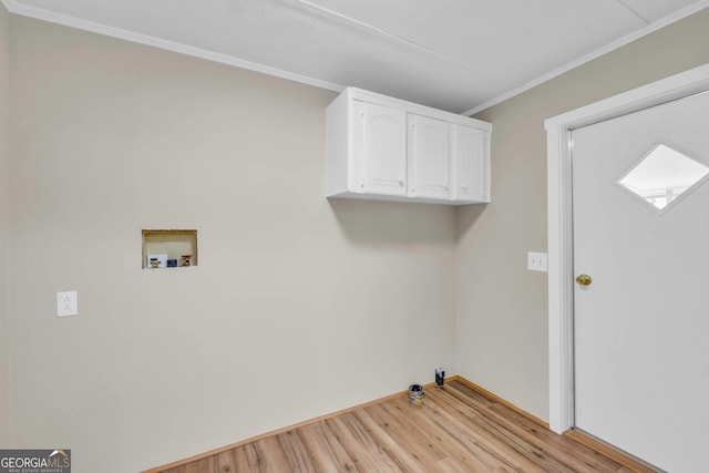 washroom featuring cabinets, hookup for a washing machine, light wood-type flooring, and crown molding