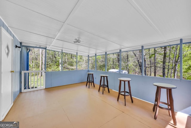 sunroom / solarium with ceiling fan