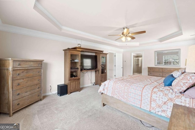 bedroom featuring light carpet, a tray ceiling, ceiling fan, and ornamental molding