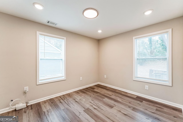 spare room with light wood-type flooring