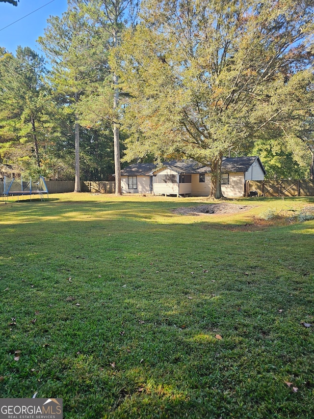 view of yard featuring a trampoline