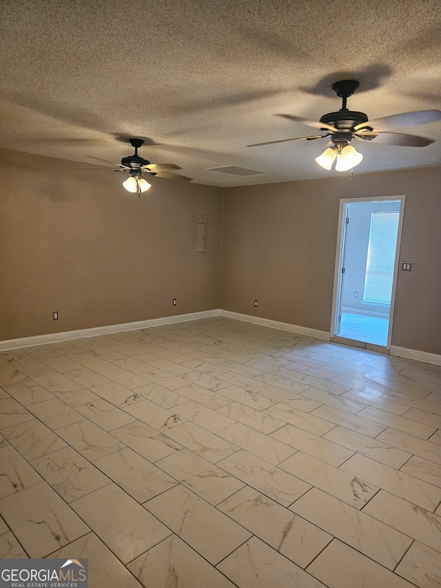 unfurnished room featuring a textured ceiling and ceiling fan