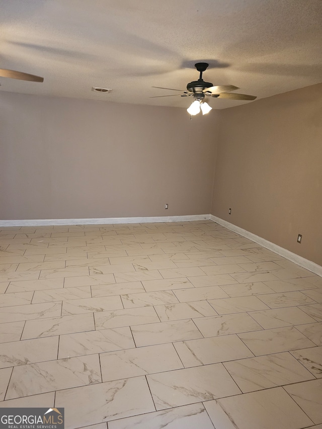 unfurnished room featuring a textured ceiling and ceiling fan