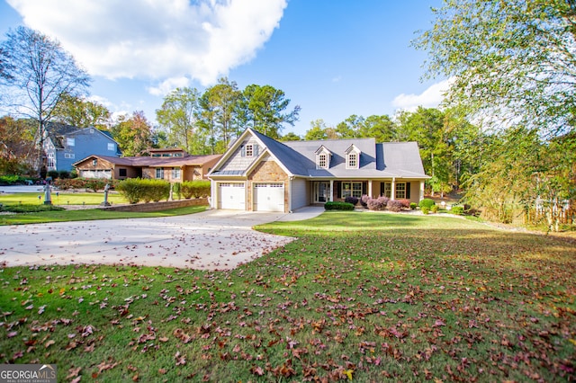 view of front of home with a front yard and a garage