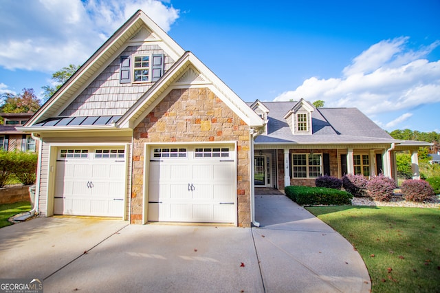 view of front facade with a garage and a front lawn