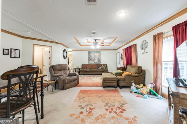 living room featuring crown molding, light carpet, and ceiling fan