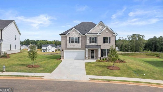 view of front of property with a garage and a front yard