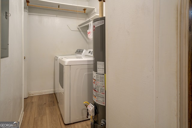 laundry area featuring light hardwood / wood-style floors, separate washer and dryer, and water heater