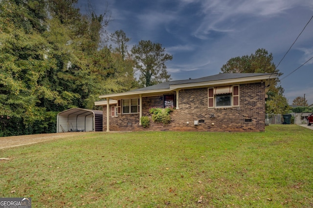 ranch-style home with a front yard and a carport