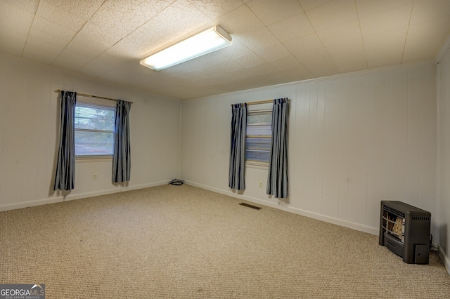 carpeted empty room featuring ornamental molding