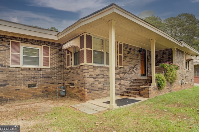 view of home's exterior with a yard