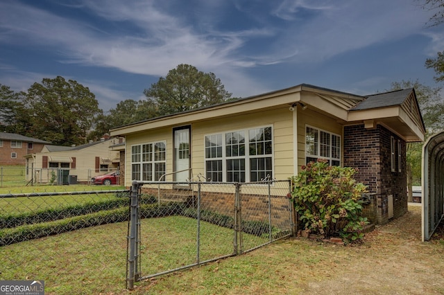 view of property exterior with a lawn