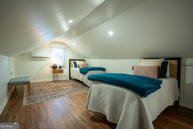 bedroom featuring a wall mounted AC, dark hardwood / wood-style flooring, and vaulted ceiling