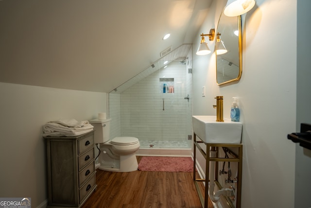 bathroom featuring hardwood / wood-style floors, an enclosed shower, vanity, and toilet