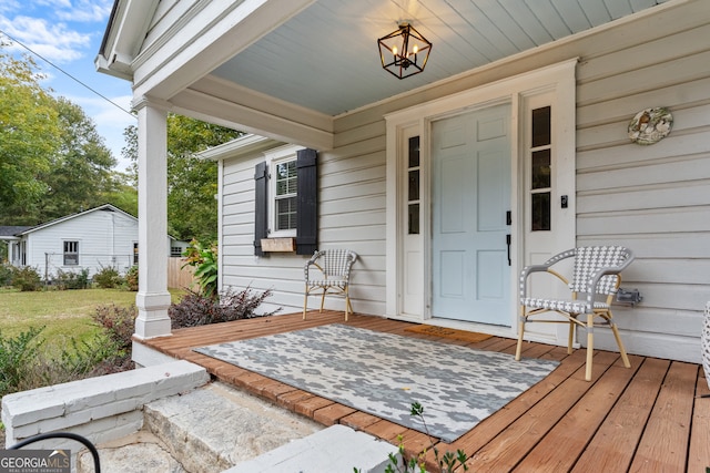 property entrance with covered porch