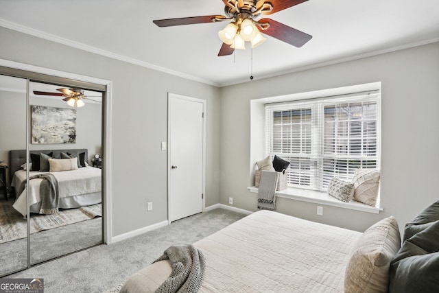 carpeted bedroom featuring ceiling fan and crown molding